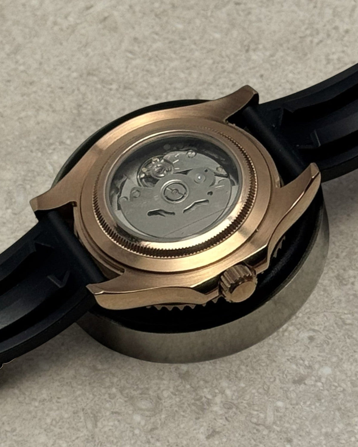 PB TimePiece Yachtmaster watch showing the rose gold case back and exhibition movement with black rubber strap