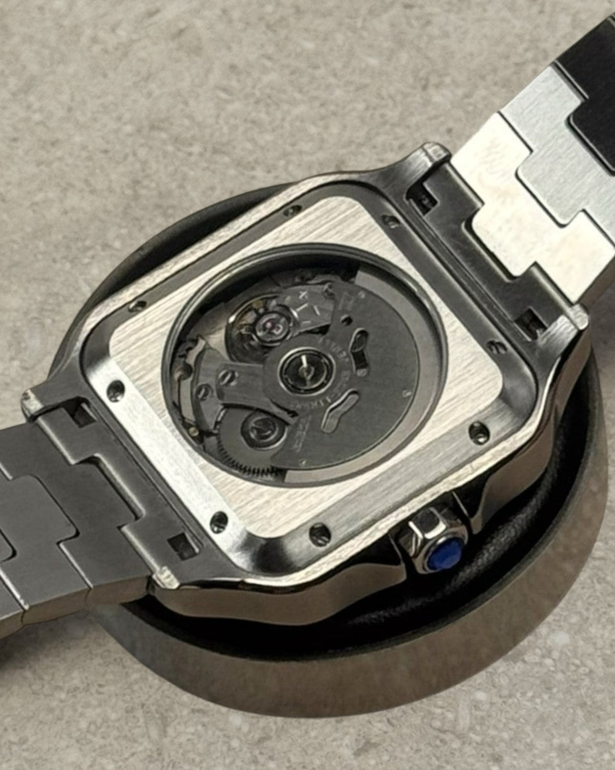 PB TimePiece Aviator Skeleton watch showing the clear case back, stainless steel bracelet, and automatic movement.