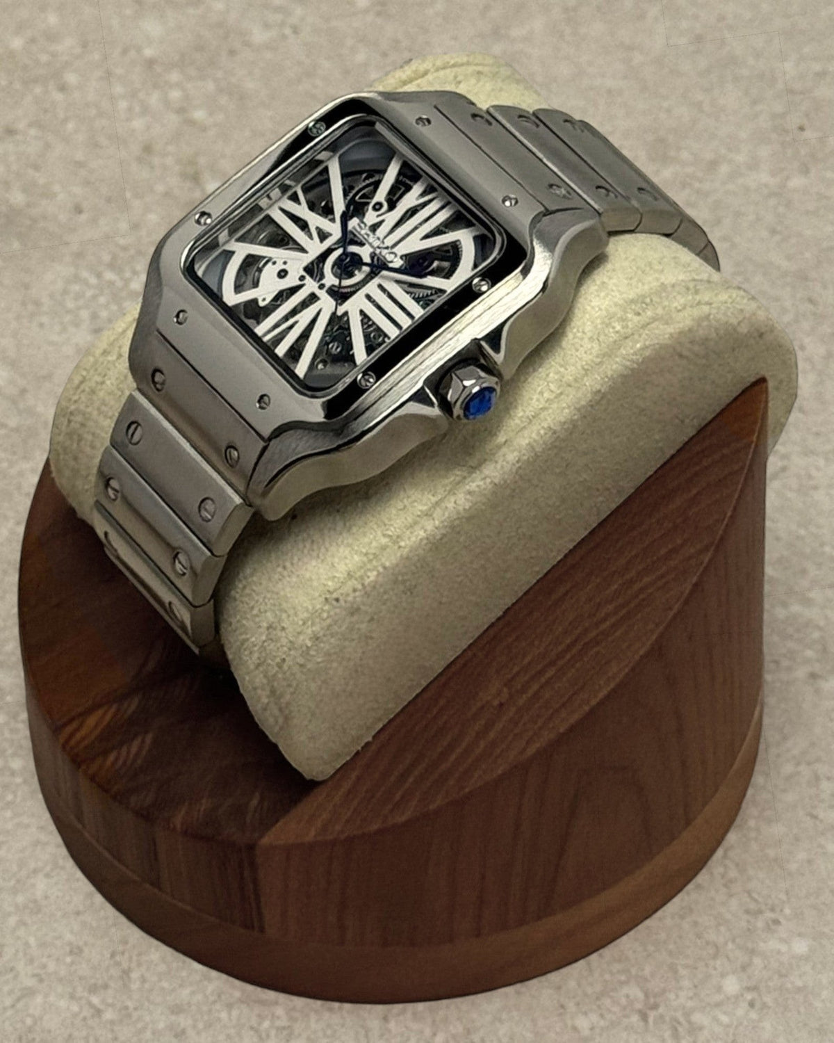 PB TimePiece Aviator Skeleton watch with a stainless steel 38mm case, skeleton dial, and blue hands on a display stand