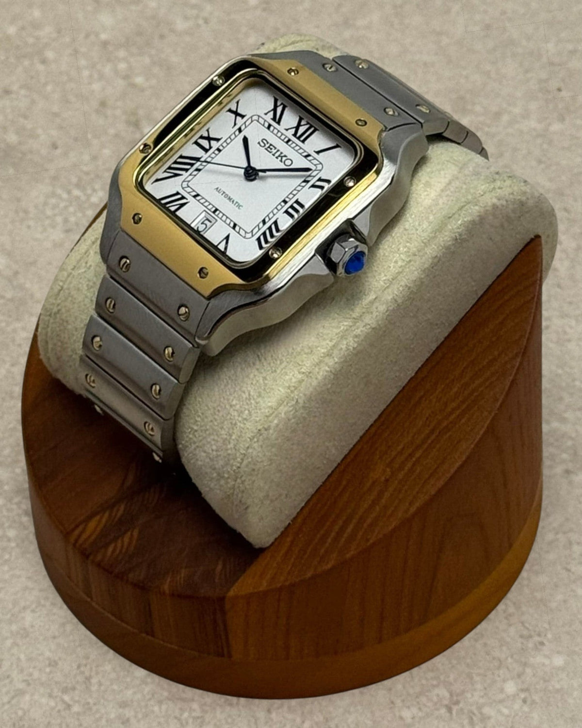 PB TimePiece Aviator watch with two-tone gold and stainless steel case, white dial, Roman numerals, and blue hands.