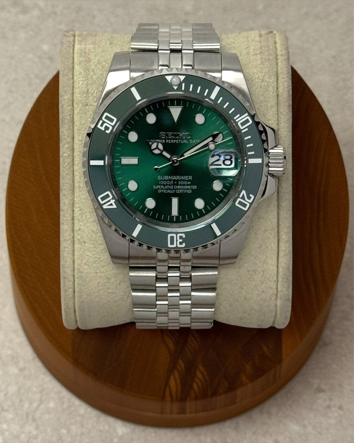 PB TimePiece Submariner Hulk watch with emerald green dial, rotating green bezel, and stainless steel jubilee bracelet