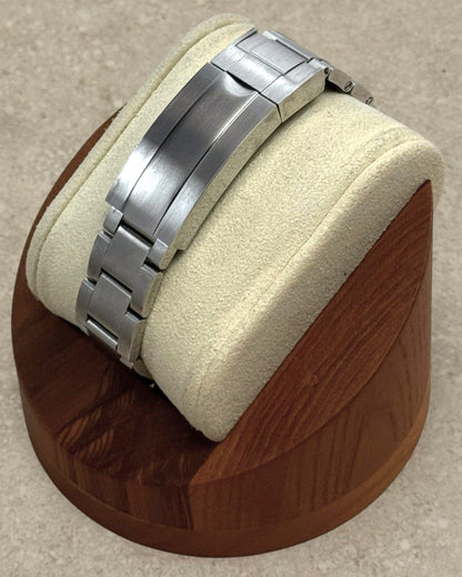 PB TimePiece Yachtmaster watch featuring a brushed stainless steel oyster bracelet on a wooden display stand