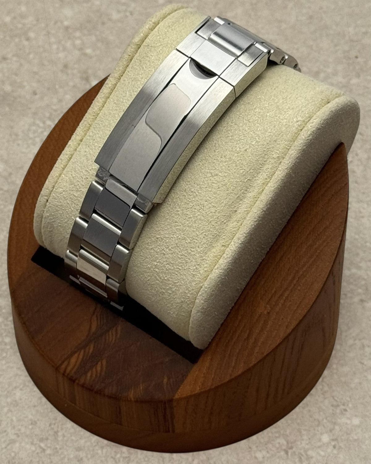 PB TimePiece stainless steel watch bracelet with microadjusting clasp on a display stand