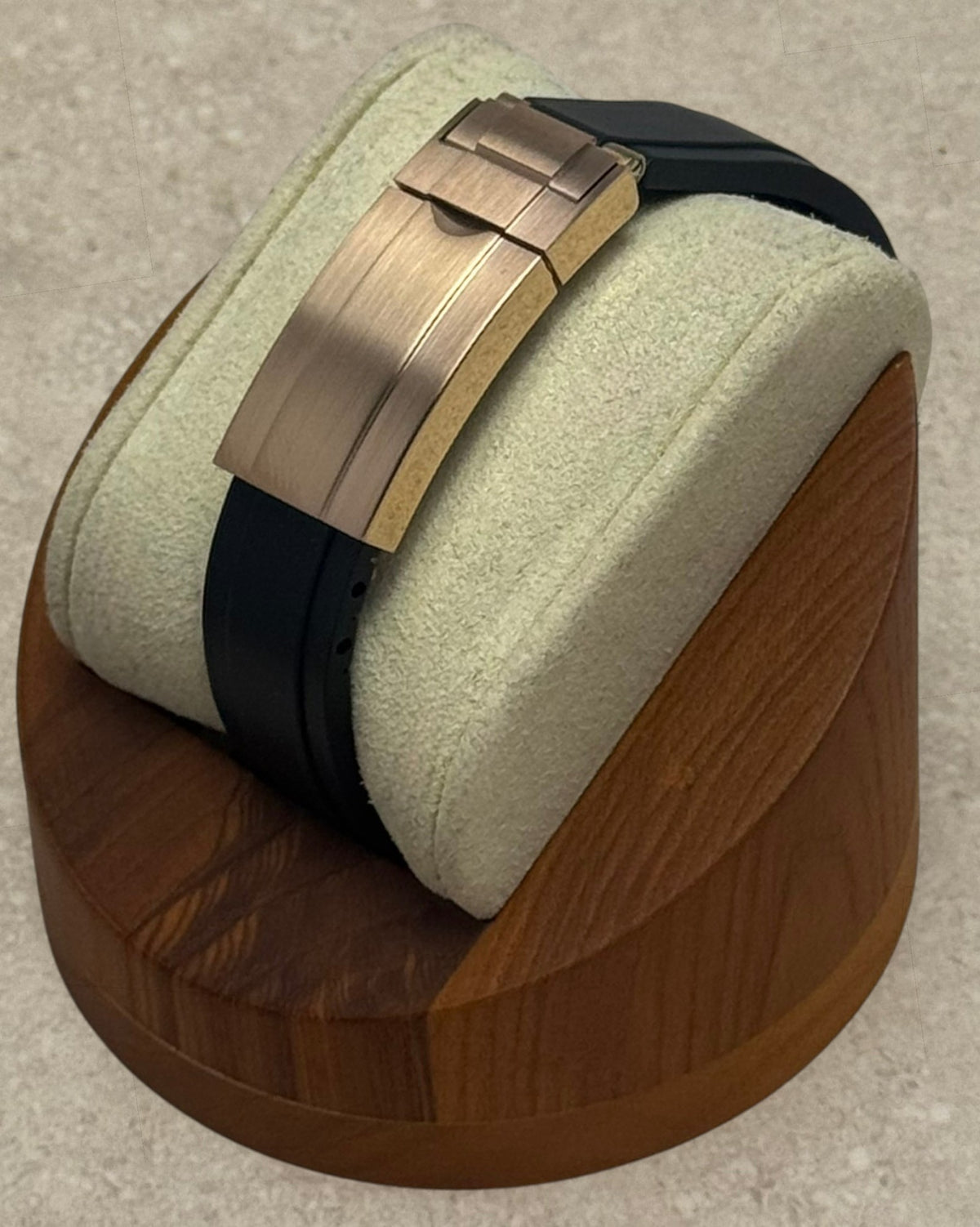 PB TimePiece Yachtmaster watch featuring a black rubber strap and a rose gold micro-adjusting clasp on a display stand